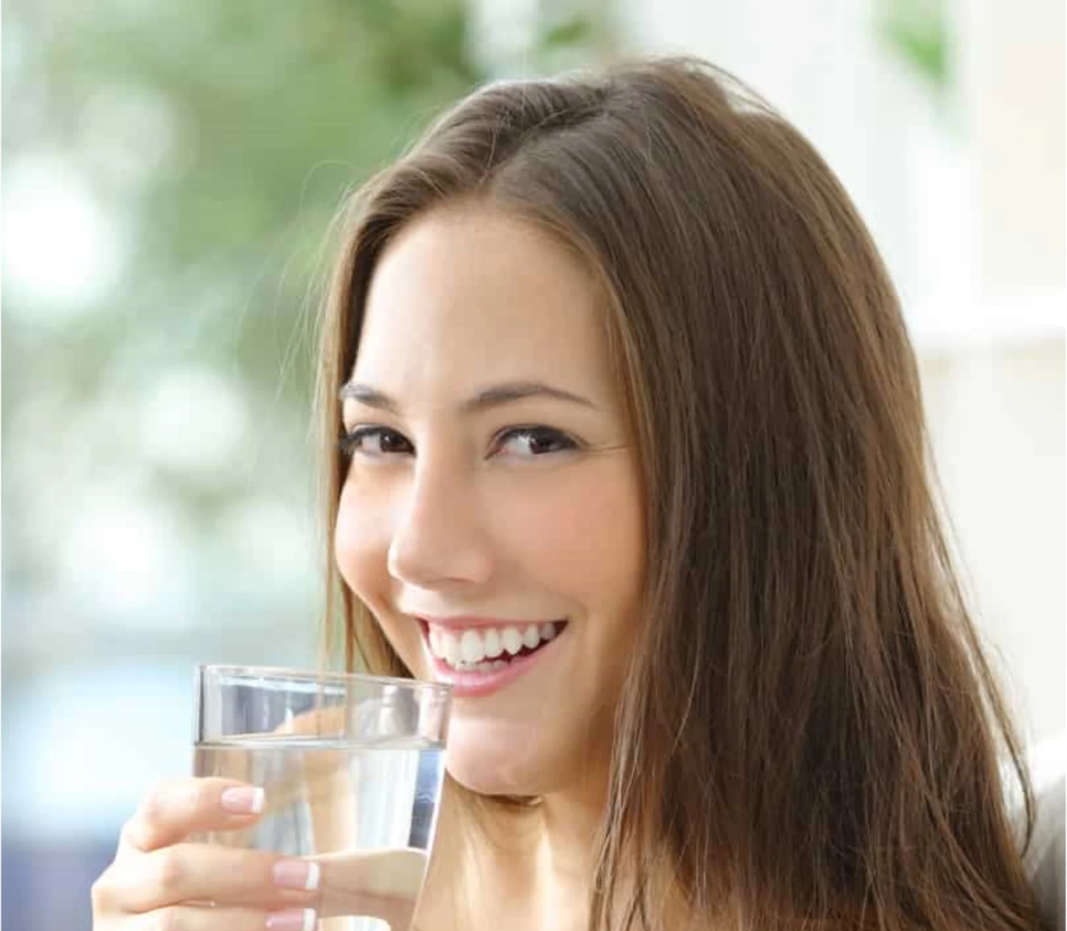 Smiling Woman Drinking Pure Water